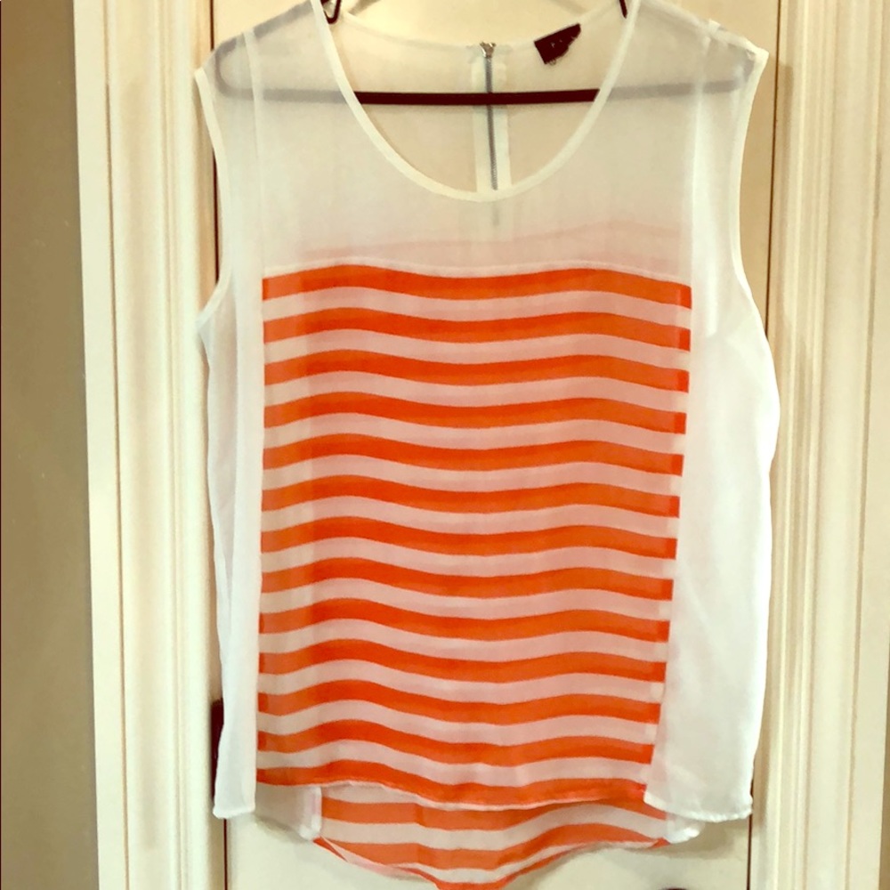 Sheer orange and white blouse.